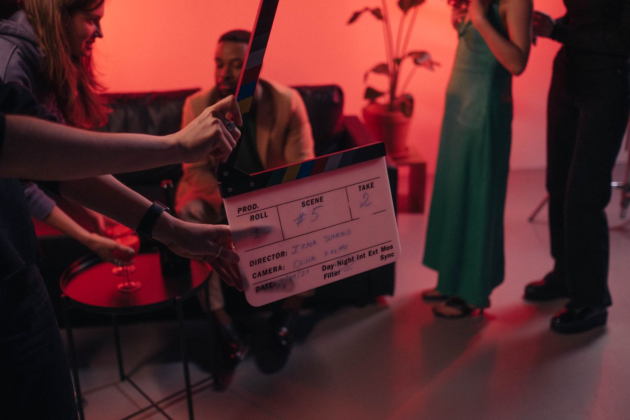 How to Approach a Film Buyer: Strategies for Independent Producers (2026) 5 Film production crew member holding a clapperboard on a movie set
