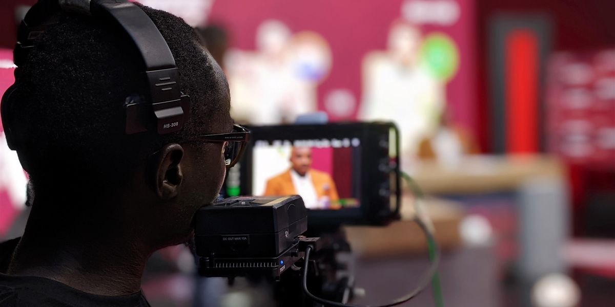 Broadcast cameraman operating professional camera in a TV production studio — types of TV formats guide