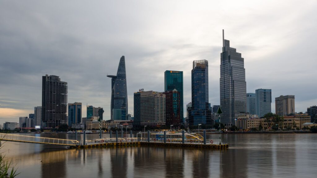 Ho Chi Minh City skyline at dusk with the Saigon River in the foreground