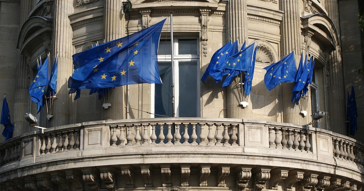 European Film Financing: The Complete Guide for Producers and Financiers in 2026 3 European Union flags on a government building balcony, symbolizing EU institutional funding for film co-production.