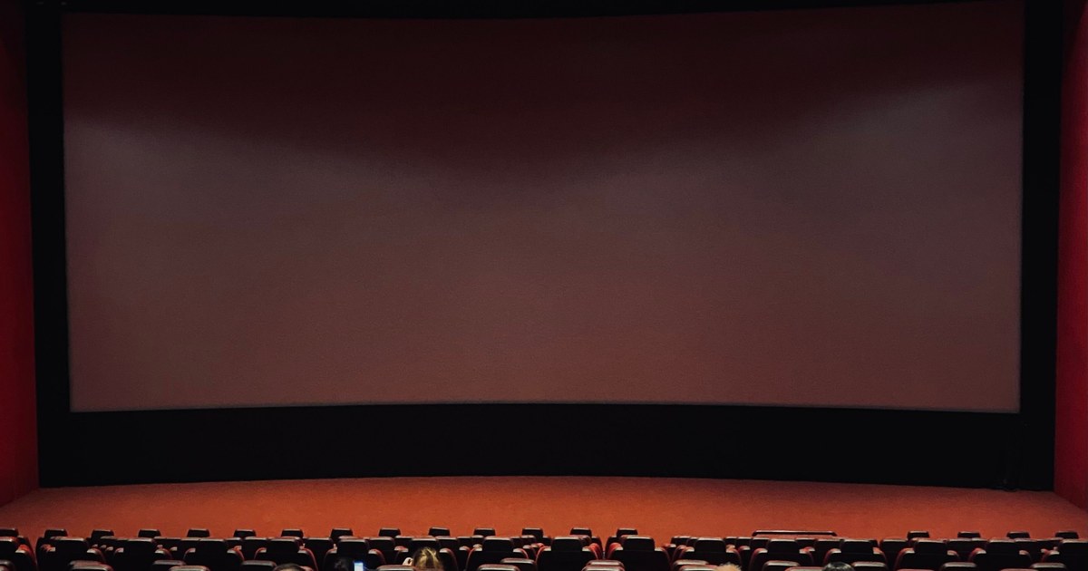 Film Licensing Deals Explained 5 Empty cinema screen and seating, representing theatrical and Pay-1 licensing windows in a film distribution deal