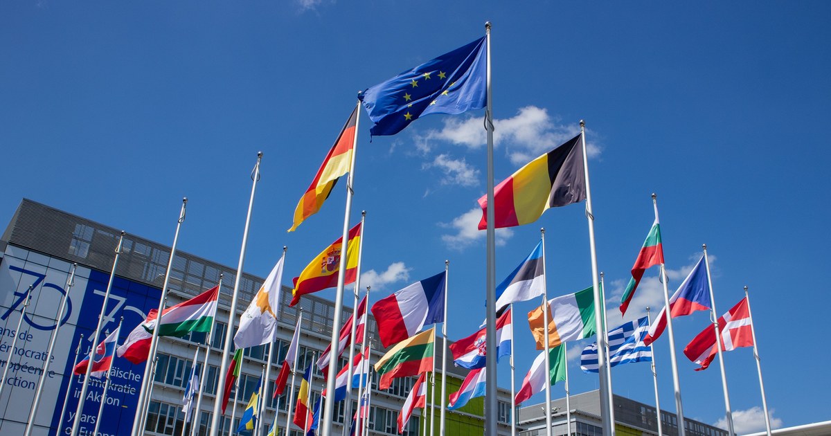 Film & TV Co-Production Tax Breaks Compared 2 National and EU flags flying together, representing the range of film and TV co-production tax incentive countries compared in this guide