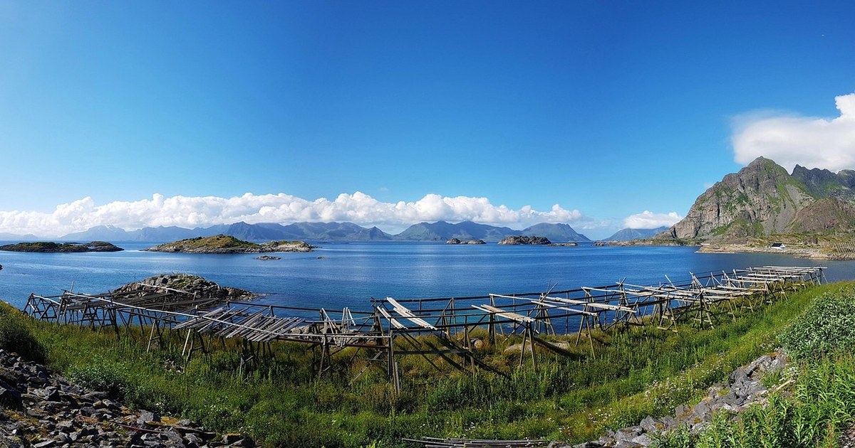 Nordic Co-Production & Financing Guide: Sweden, Norway, and Denmark 5 A Norwegian fjord landscape with steep cliffs meeting calm coastal water, representing Nordic film production locations.