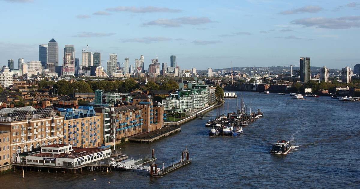 UK Production Finance & Commissioning: Tax Relief, PACT Agreements, and Broadcaster Deals 7 London skyline with Canary Wharf across the Thames, representing UK production finance and broadcaster commissioning.