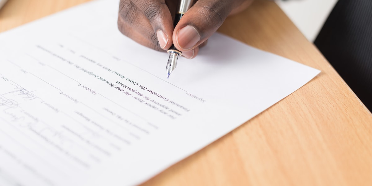 The Secondary Market for Film Production Debt, Explained 2 Contract signing representing secondary market trading of film production debt